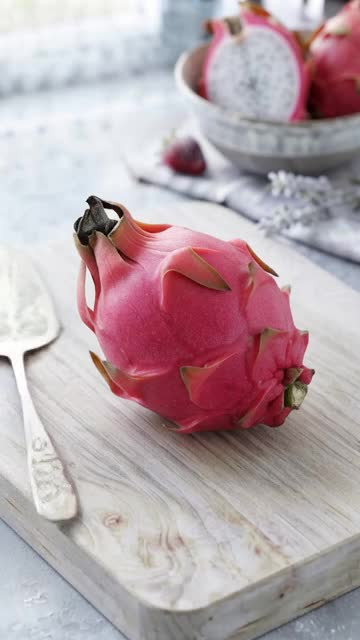 cutting a wax dragon fruit - fruit cutting poster design AI video