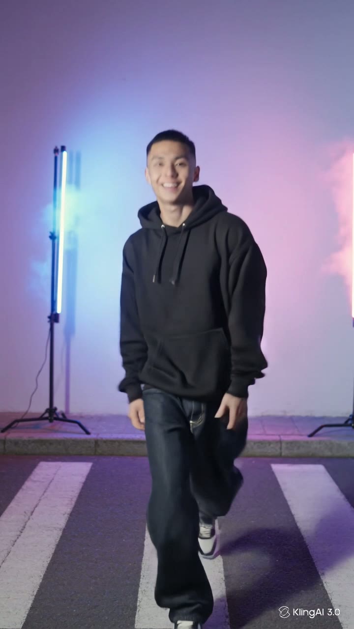 A young creator in a plain black hoodie dancing toward the camera on a neon-lit street, framed vertically for a phone screen — a still from an AI-generated TikTok-style clip.